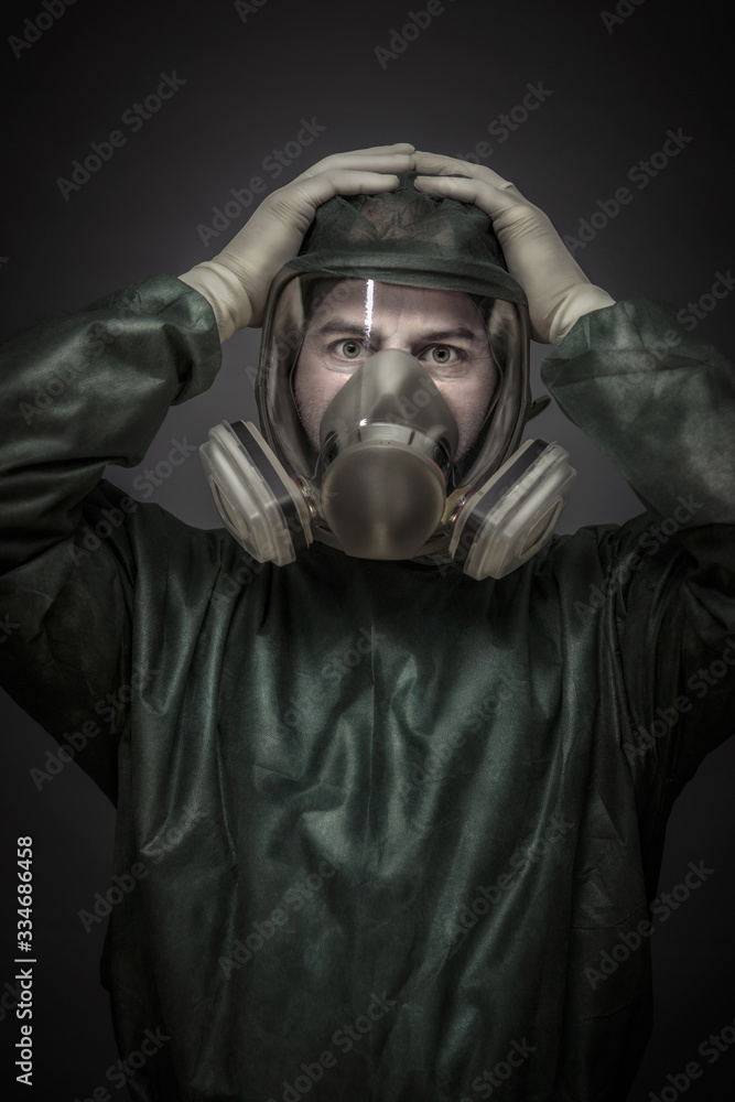 portrait of a doctor with hands on his head and protective mask portrait of a doctor with hands on his head and protective mask