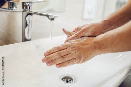 Washing hands rubbing with soap man for corona virus prevention, hygiene to stop spreading coronavirus.
