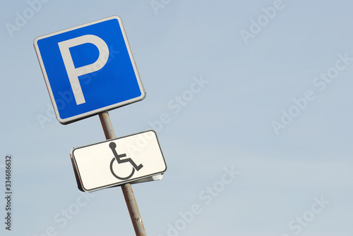 disabled parking road sign diagonally tilted