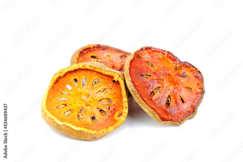 Group of dried bael fruit slices isolate on white background. Group of dried bael fruit slices isolate on white background.
