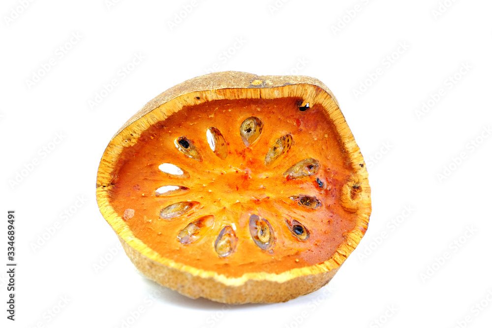 Dried bael fruit slice isolate on white background. Dried bael fruit slice isolate on white background.