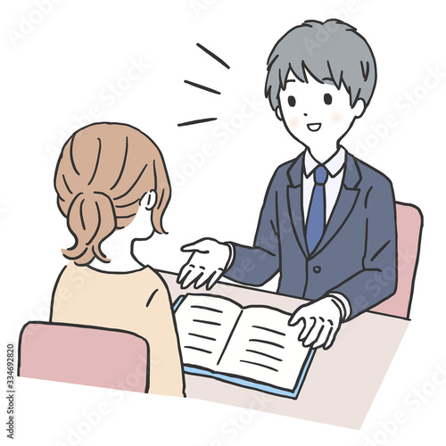 お客様と打ち合わせする男性スタッフ