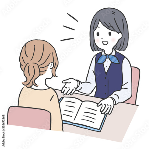 お客様と打ち合わせする女性スタッフ
