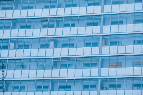 Glass facade of a residential building. Modern apartment building  glazed balconies of new apartments  construction.