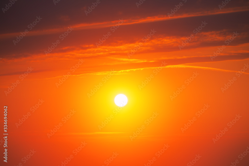 Orange sunrise  with clouds and sun
