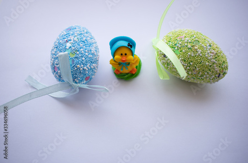 Easter eggs and chicken on a white background