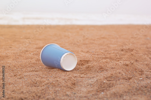 garbage is lying on the ground on the beach