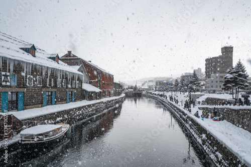 Otaru Canal on a winter day in Otaru close to Sapporo in Hokkaido, Japan. Snowy and cloudy day.