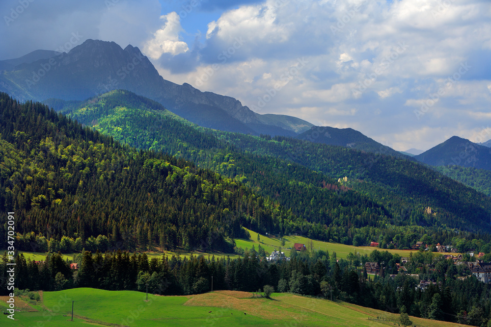 Panoramic view of Western Tatra Mountains with Giewont, Czerwone Wierchy and Nosal peaks seen from Toporowa Cyrhla village near Zakopane in Poland