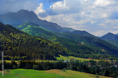 Panoramic view of Western Tatra Mountains with Giewont, Czerwone Wierchy and Nosal peaks seen from Toporowa Cyrhla village near Zakopane in Poland
