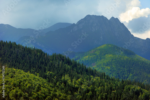 Panoramic view of Western Tatra Mountains with Giewont, Czerwone Wierchy and Nosal peaks seen from Toporowa Cyrhla village near Zakopane in Poland