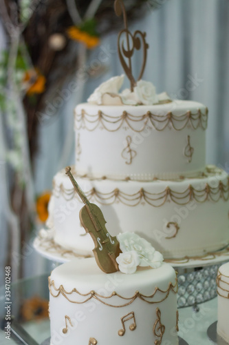 White wedding cake with golden decorations