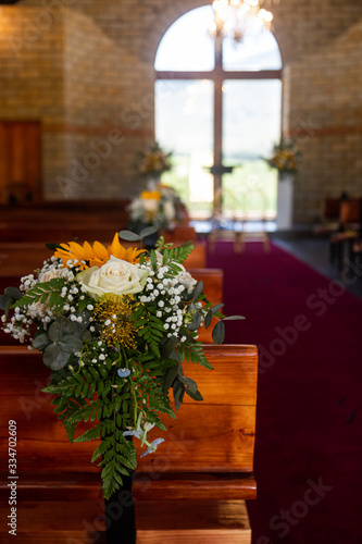 Flower decorations on church pews