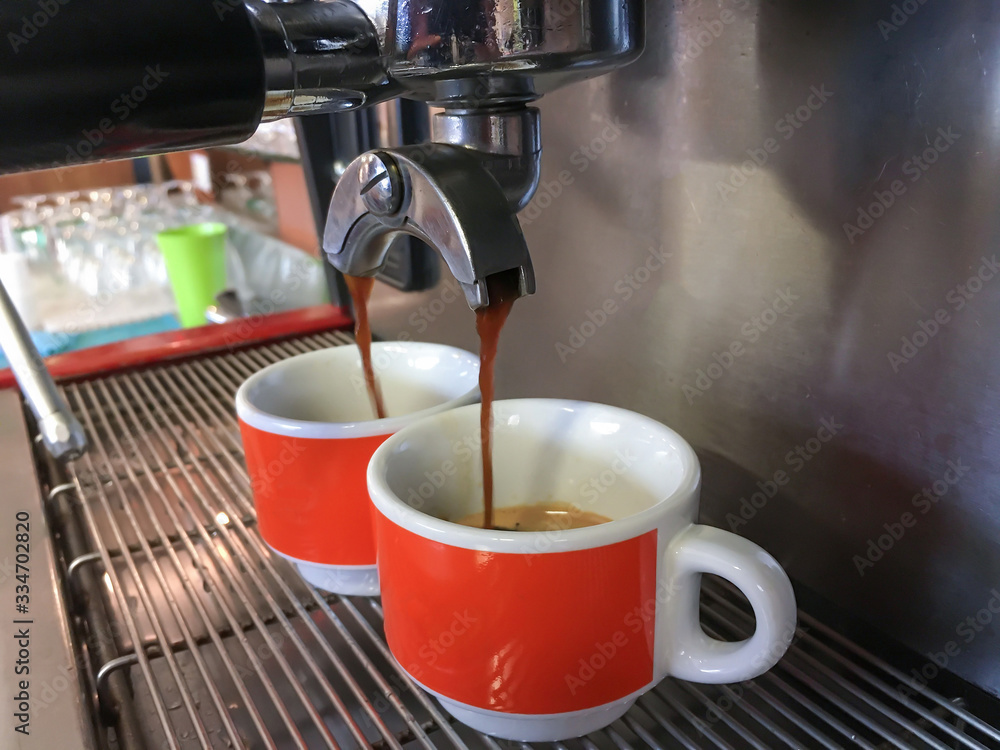 Espresso machine making coffee in bar Espresso machine making coffee in bar