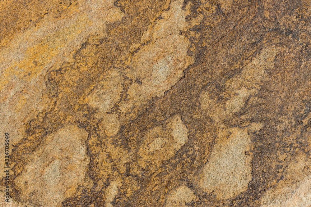 The texture of the stone is shot closeup of ordinary sandstone. The texture of the stone is shot closeup of ordinary sandstone.