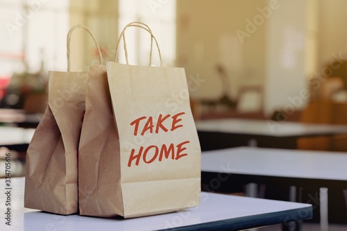 A woman order some food take home for eating in house during self quarantined, COVID-19 crisis