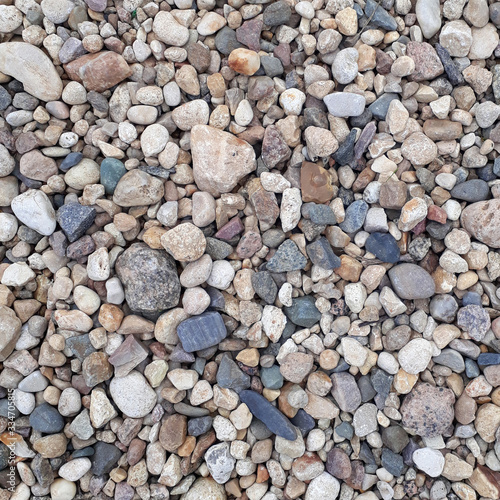 Abstract background with gray and colored pebble stones