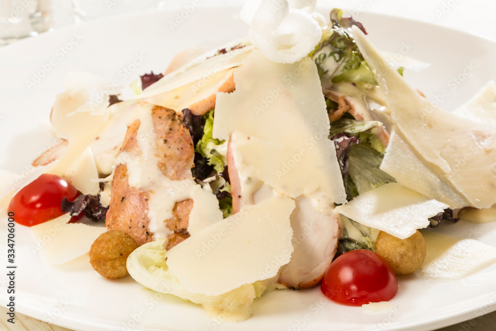 Fresh vegetable salad with cheese and meat. Close-up shot in a restaurant. Fresh vegetable salad with cheese and meat. Close-up shot in a restaurant.