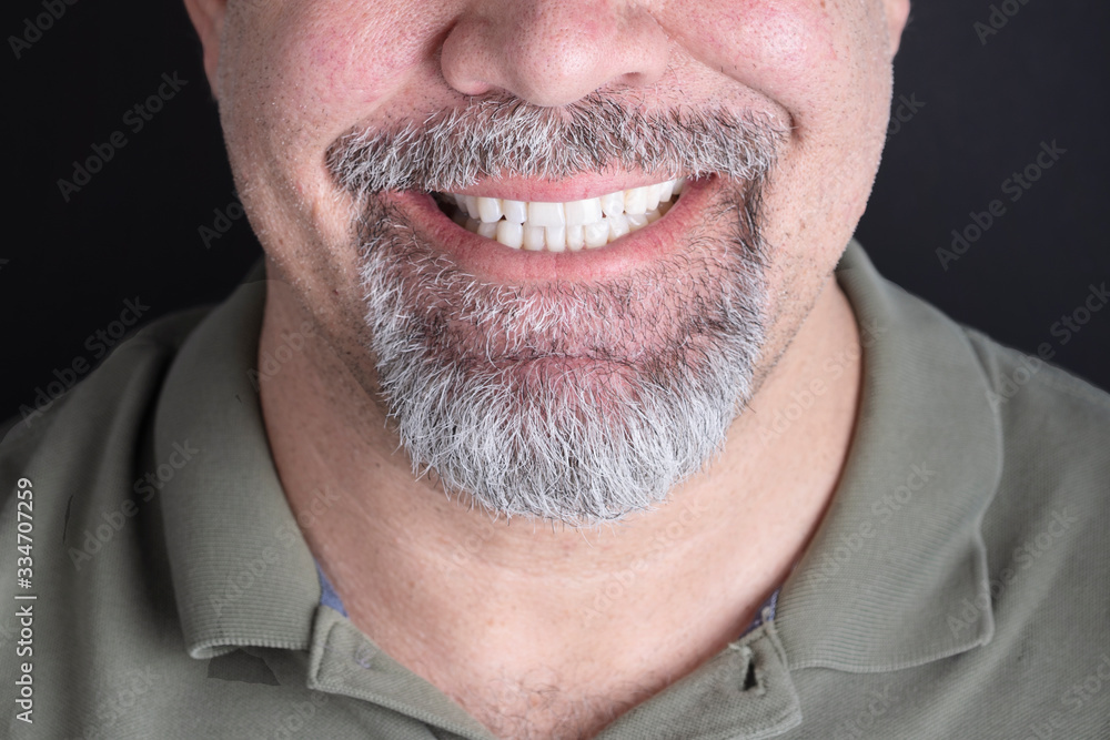 smile with white teeth men with a beard close-up smile with white teeth men with a beard close-up
