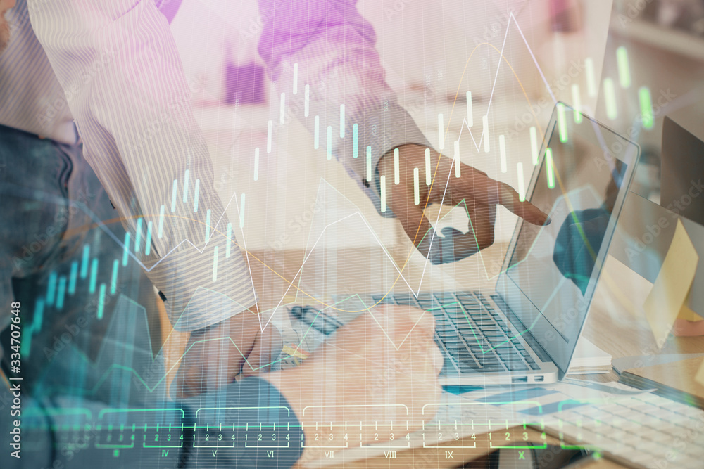 Double exposure of graph with man typing on computer in office on background. Concept of hard work. Closeup. Double exposure of graph with man typing on computer in office on background. Concept of hard work. Closeup.