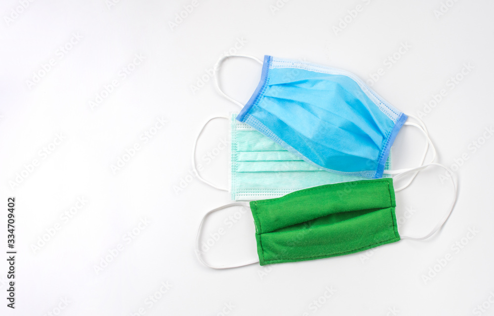 Group of Medical mask use for wearing on the face to against infection coronavirus place on white background with copy space,Covid-19 prevention. Group of Medical mask use for wearing on the face to against infection coronavirus place on white background with copy space,Covid-19 prevention.