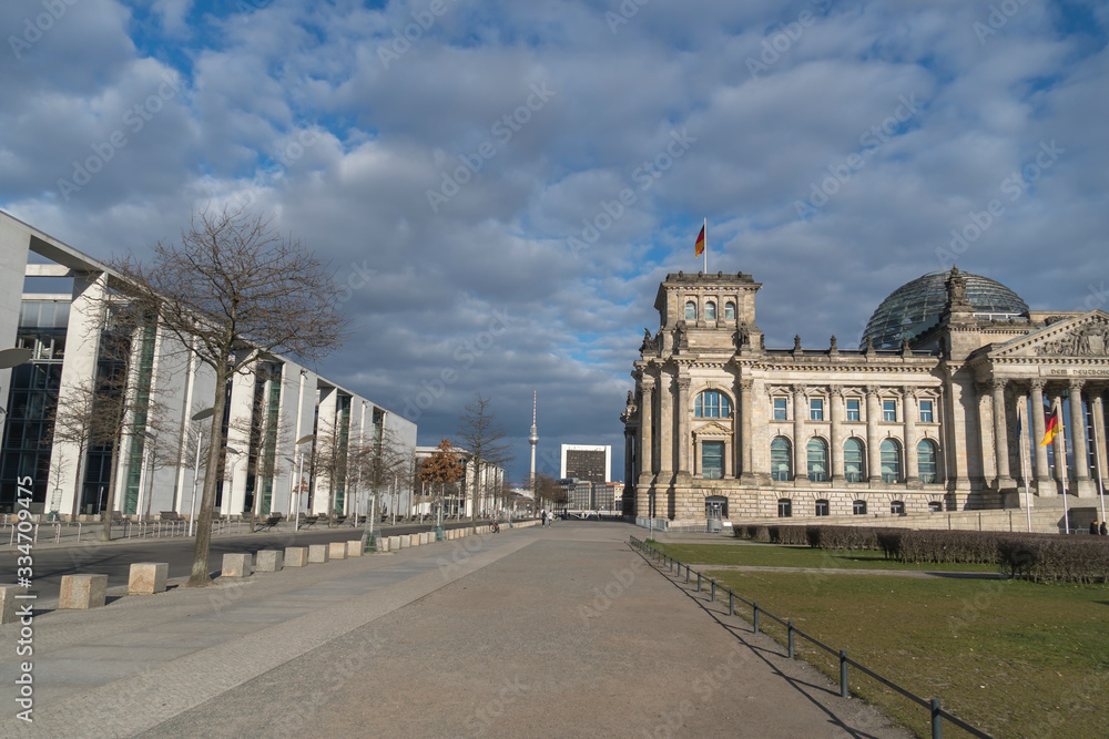 Obraz premium View of Berlin's landmarks, the Bundestag and Berliner Fernsehturm surrounded by empty streets during the city's lockdown due to the COVID-19 spreading