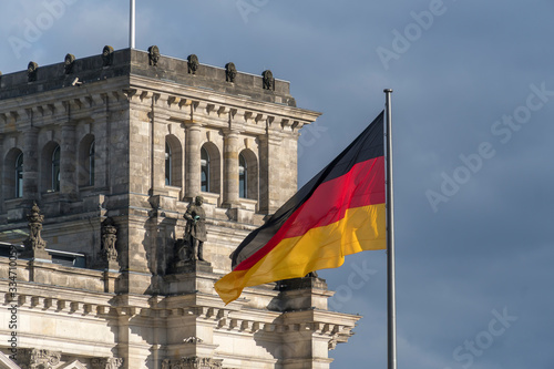 German flag fluttering outside the Berlin Bundestag Reichstag or Bundestag, seat of the German Parliament