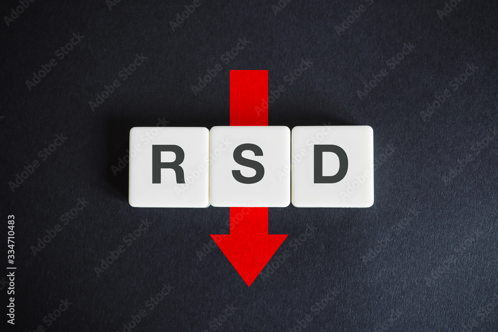 Serbian dinar alphabetic currency ISO code (RSD) and down red arrow on black background. Economy of Serbia. Serbian dinar alphabetic currency ISO code (RSD) and down red arrow on black background. Economy of Serbia.