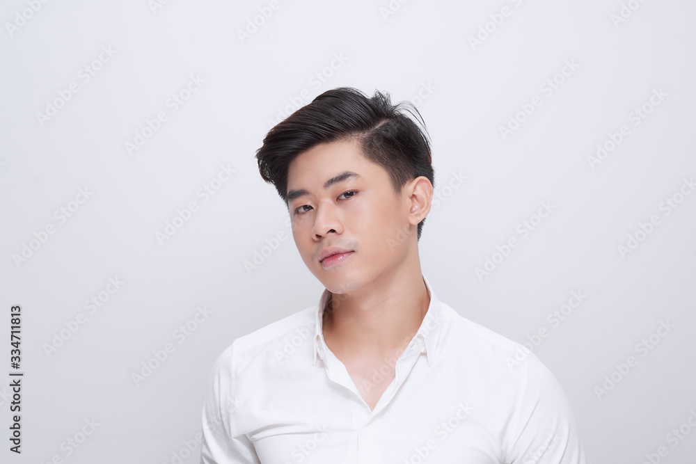 Closeup of happy smiling guy looking at camera isolated on white background Closeup of happy smiling guy looking at camera isolated on white background
