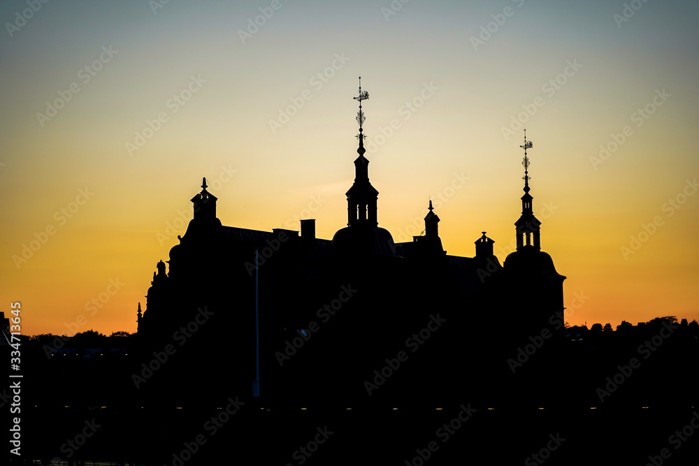 Silhouette of Helsingor station building in sunset sky, Denmark Silhouette of Helsingor station building in sunset sky, Denmark