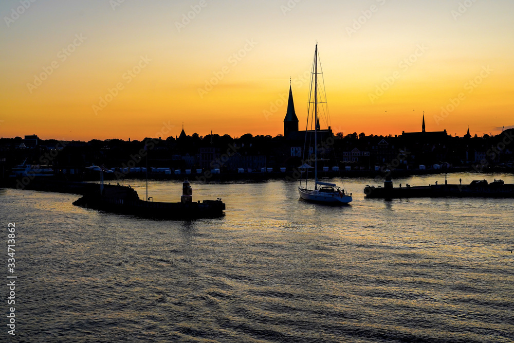 Silhouette of Helsingor harbour in sunset sky, Denmark
