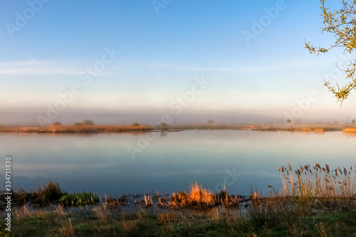 beautiful sunny landscape with river, sun shines