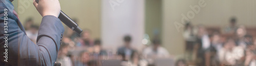 Meeting concept. Conference blur with business people training and learning. Coaching concept with blurred background. Speaker talking to audience in hall during seminar event. Lecture series speech. 