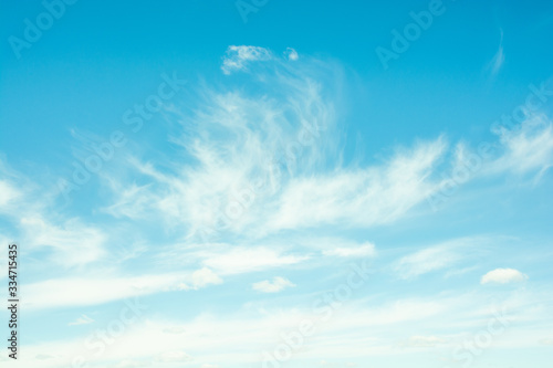 The movement of clouds on a blue sky.