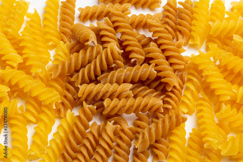 Raw italian pasta on a white background