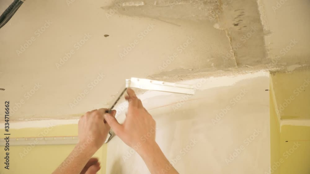 installation of a stretch ceiling. The master fastens with a ...