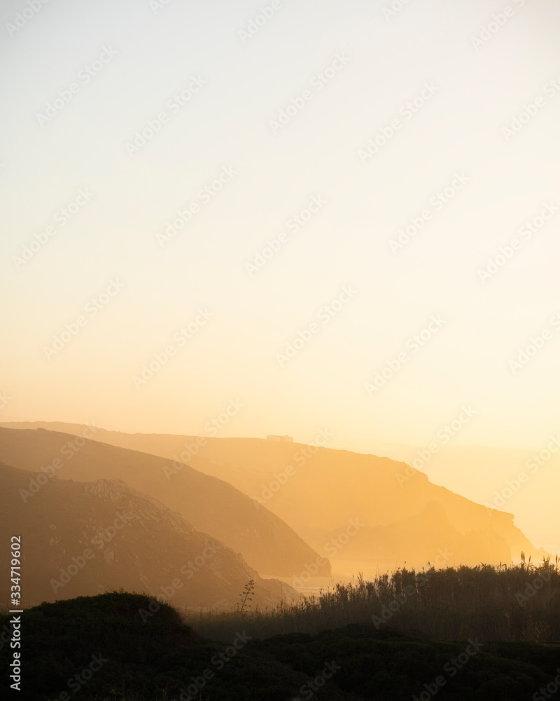 Sunset over the ocean in Praia do Amado, Portugal Sunset over the ocean in Praia do Amado, Portugal