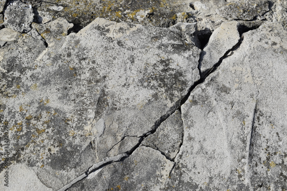 The surface and texture of the destroyed concrete slab.