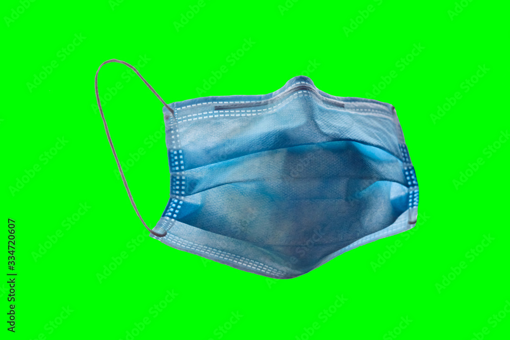 Blue surgical face mask against green screen. Blue surgical face mask against green screen.