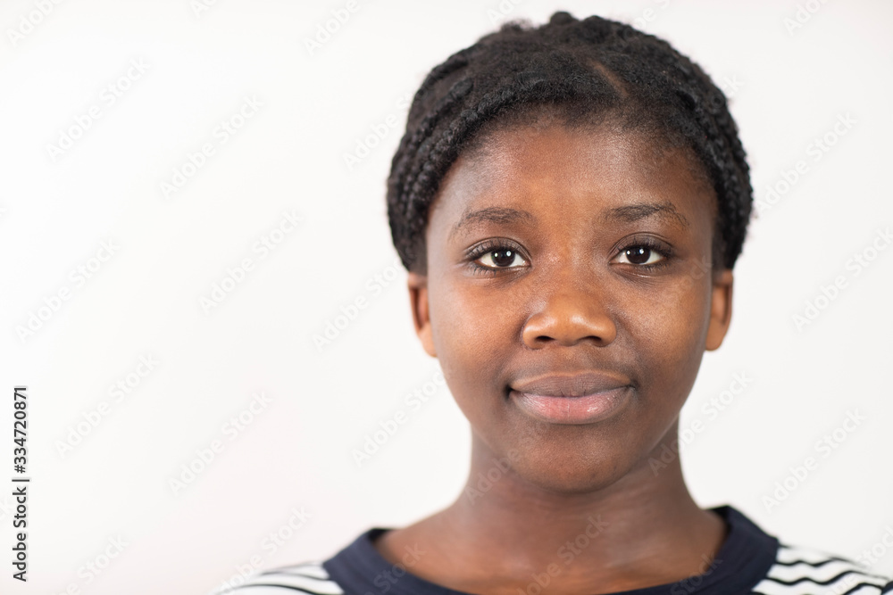Head and Shoulders Studio Portrait Of Smiling Teenage Girl Against White Background Head and Shoulders Studio Portrait Of Smiling Teenage Girl Against White Background