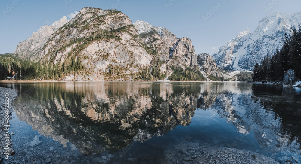 Obraz premium The unesco world heritage Dolomites in Italy lake named Lago de braise, Italy. Beautiful landscape of snowy mountains. Panorama shot. 
