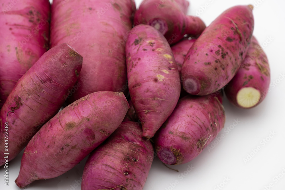 Pile of whole purple daikon radish isolated on white background Pile of whole purple daikon radish isolated on white background