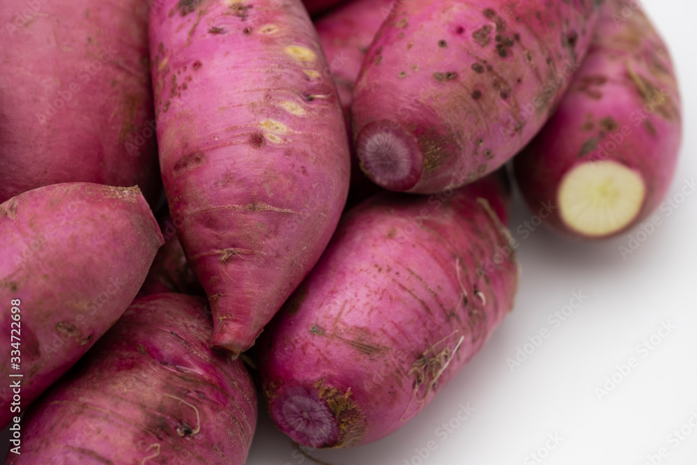 Pile of whole purple daikon radish isolated on white background Pile of whole purple daikon radish isolated on white background