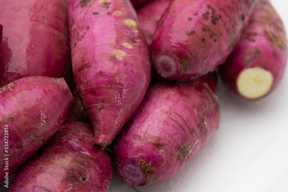 Pile of whole purple daikon radish isolated on white background Pile of whole purple daikon radish isolated on white background