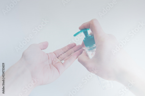 Male hand using sanitizer to disinfect from Covid-19 bacteria. 