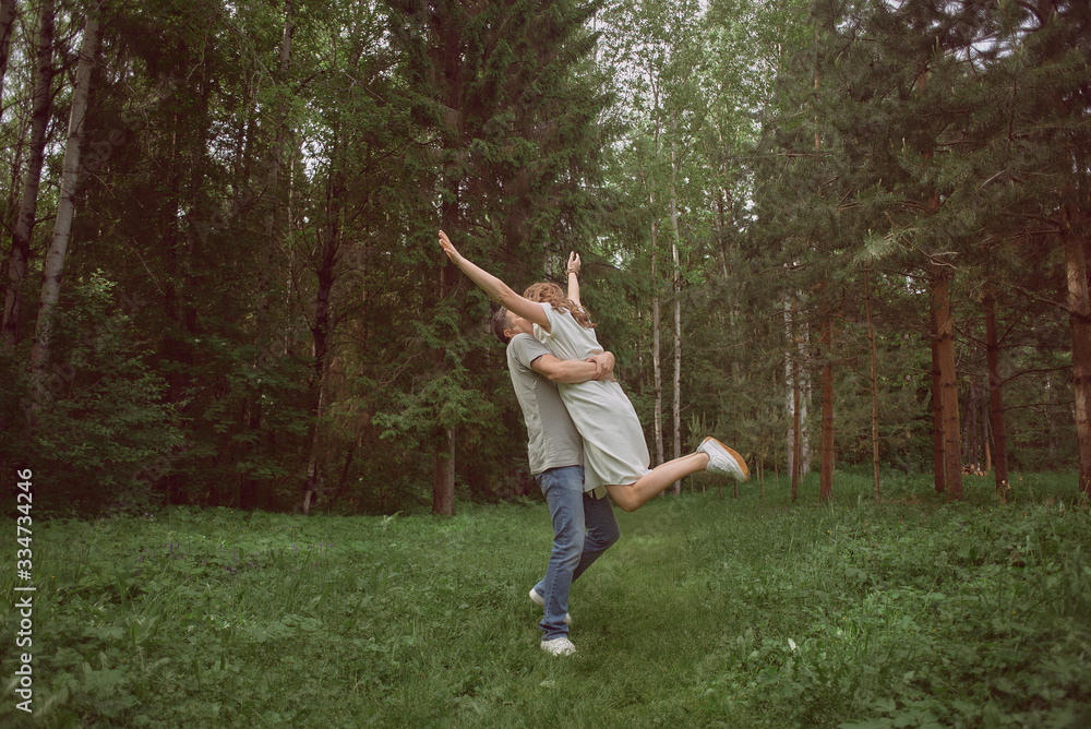 couple hugging in the forest couple hugging in the forest