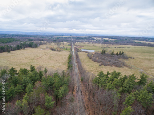 aerial view of Road in field and forest 