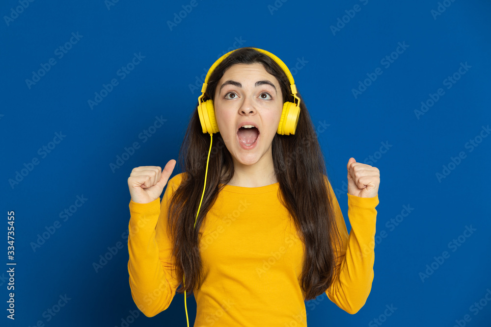 Brunette young girl wearing yellow jersey Brunette young girl wearing yellow jersey