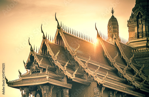 Roofs in Thai architecture kind of temple palace over sunset or sunrise. Building religion in Thailand
