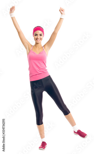 Young happy woman in red fitness wear doing fitness exercise, isolated over white background
